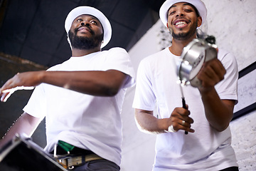 Image showing Show, drums or happy band in carnival playing an instrument in festival in Rio de Janeiro. Brazil, low angle or group of musicians or artists banging on a drum to create a beat in party performance