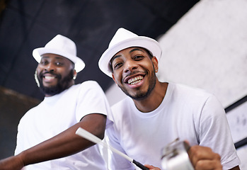 Image showing Show, music or portrait of band in carnival playing an instrument in festival in Rio de Janeiro. Brazil, night or group of happy male artists banging on a drum to create a beat in party performance