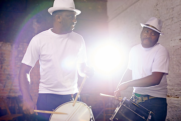 Image showing Night, drum or men in band for carnival playing an instrument in festival in Rio de Janeiro, Brazil. Black people, show or group of male artists banging to create a beat in party or music performance