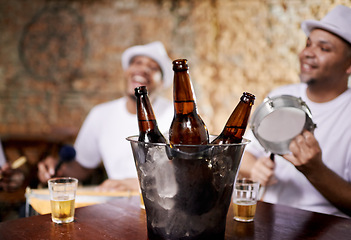 Image showing Musician, band and group with drink, men and happy for drums, performance and party with alcohol. Friends, artist and singing with bottle, beer and relax in pub for social event in Rio de Janeiro