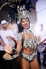 Image showing Samba, dance and woman in performance at carnival, festival and event in Brazil for summer celebration of culture. Salsa, dancer and creative fashion at party with energy to music or people at club