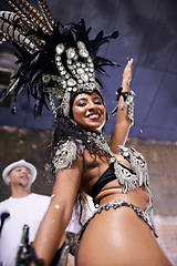 Image showing Dancer, carnival and girl in portrait with confidence, pride or culture in low angle for music performance in night. Person, woman and stage at event, party and smile at celebration in Rio de Janeiro