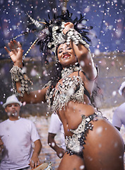 Image showing Dance, performance and woman samba at carnival, festival and event in Brazil for summer celebration of culture. Happy, dancer and creative fashion for salsa, party and night with confetti and music