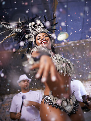 Image showing Dance, performance and woman samba at carnival, festival and event in Brazil for summer celebration of culture. Happy, dancer and creative fashion for salsa, party and night with confetti and music