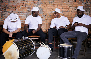 Image showing Music, drums or men in band on break or playing an instrument in a festival in Rio de Janeiro. Brazil, phone or group of male musicians, performers or artists in discussion or conversation to relax