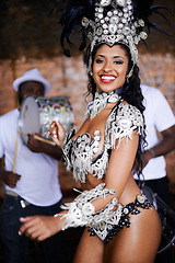 Image showing Dancer, carnival and woman with performance, portrait or pride for culture in group, music or band in night. Girl, smile and men dancing at event, party and celebration with drums in Rio de Janeiro
