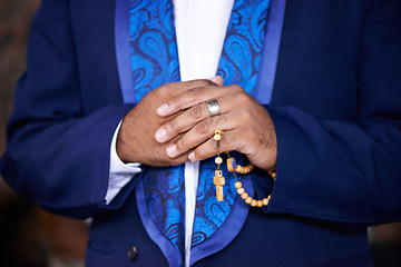 Image showing Worship, praying or hands of man with rosary for God, faith or belief for support or hope in Christian religion. Closeup, priest or person with prayer beads for spiritual healing, praise or trust