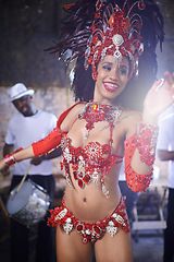 Image showing Show, dance and woman at carnival with costume for celebration, music and happy band performance in Brazil. Samba, party and girl in street festival, parade and culture in Rio de Janeiro with smile.