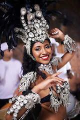 Image showing Culture, portrait and woman at carnival with costume for celebration, music and happy dance performance in Brazil. Samba, party and girl at festival, parade or show in Rio de Janeiro with smile.