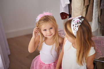 Image showing Girl, sister and portrait with fairy costume in bedroom of home for dress up, fantasy play or tiara with smile. Family, children and face with princess outfit for bonding, fashion or happy with wings