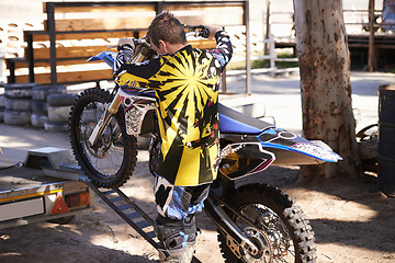 Image showing Motorcycle, man and sport for outdoor training, competition and adventure on trailer. Extreme sports, adrenaline and motorbike of young male person, athlete or biker in Minneapolis with back view.