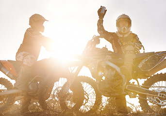 Image showing Sport, racer or people on motorcycle outdoor on dirt road and relax after driving, challenge or competition. Lens flare, motorbike or dirtbike driver and sunrise on offroad course or path for racing