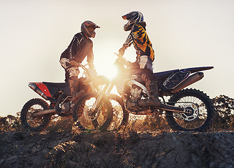 Image showing Sport, racer or people on motorcycle outdoor on dirt road with relax after driving, challenge or competition. Sunrise, motorbike or dirtbike driver with helmet on offroad course or path for racing