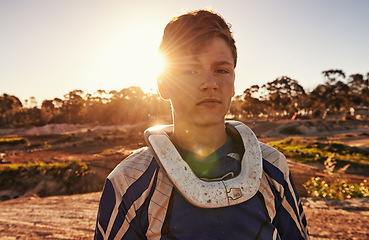 Image showing Man, motocross rider or portrait for extreme sport in nature, confident or skill in driving with speed. Man, pride face or gear for motorcycle or off road action or danger with fast vehicle in wood