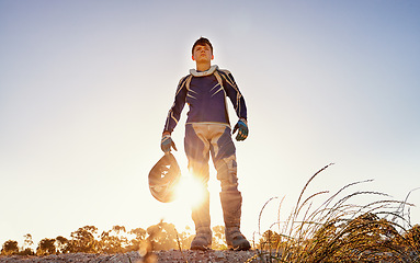 Image showing Man, motocross and rider of extreme sport in nature, confident and danger for adrenaline adventure with speed. Athlete, pride or gear for motorcycle action off road or skill in driving a fast vehicle