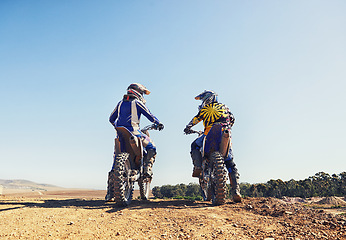 Image showing Rear view, sport or people on motorcycle outdoor on dirt road with relax after driving, challenge and competition. Sports, motorbike and dirtbike driver with helmet on offroad and path for racing