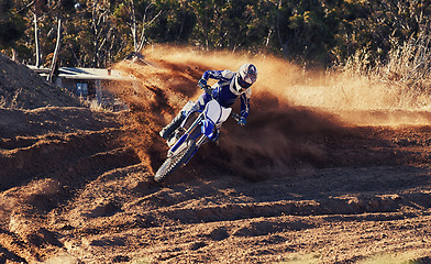 Image showing Person, dirt racer and professional motorcyclist on bike for extreme sports competition on outdoor track. Expert rider on motorbike or scrambler for sand course, challenge or off road rally in nature