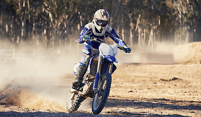 Image showing Motorcycle, action and speed with person riding on dirt track, adrenaline and skill for extreme sports outdoor. Competition, adventure and power with risk, fast with biker on motorbike for race