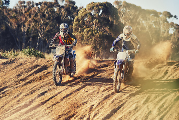 Image showing Sport, racer and motorcycle in action for challenge on dirt road with performance, competition and adventure. Motocross, motorbike or dirtbike driver with helmet on offroad course and dust in racing