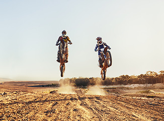 Image showing Sport, racer and motorcycle in action for competition on dirt road with performance, challenge or adventure. Professional, motorbike or dirtbike driver with stunt on offroad course or path for racing