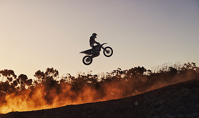 Image showing Person, jump and professional motorcyclist in the air on mockup for trick, stunt or ramp on outdoor dirt track. Expert rider on motorbike with lift off for extreme sports or rally challenge in nature