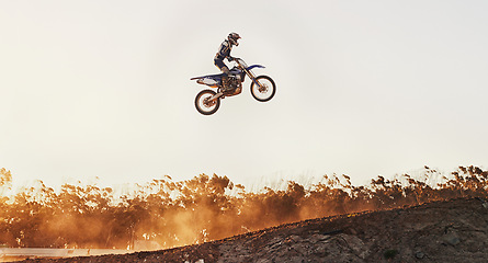 Image showing Person, jump and professional motorcyclist on mockup in the air for trick, stunt or ramp on outdoor dirt track. Expert rider on motorbike with lift off for extreme sports or rally challenge in nature