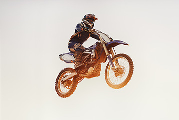 Image showing Person, jump and motorcyclist in the air for extreme sports, trick or outdoor stunt in sunset on mockup. Expert rider on motorbike or lift off for rally challenge, performance or adrenaline in nature