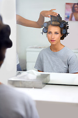 Image showing Beauty, hair curlers and woman in mirror of salon with .professional stylist for makeover. Haircare, face reflection or curling and celebrity or actress getting ready backstage behind the scenes