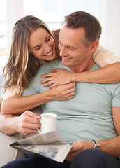 Image showing Happy couple, care and newspaper with coffee in home and bonding together with love in marriage. Man, woman and hug by cappuccino for reading headlines, sofa and romantic indoor to relax on weekend