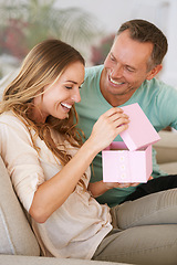 Image showing Woman open gift, man and happiness with surprise for birthday or anniversary, love and support with romance. Couple in marriage, unboxing package with ribbon and present for token of appreciation