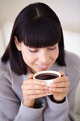 Image showing Morning, relax and woman on coffee break in home to with smile from happiness of latte. Female person, peace and tea cup for girl in apartment for enjoying, espresso and cozy in house with dink