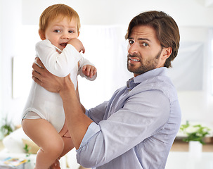 Image showing Baby boy, father and portrait with disgusted face, foul smell and dirty diaper to change. Male toddler, dad and people at home, living room or house for parenthood, child development and hygiene