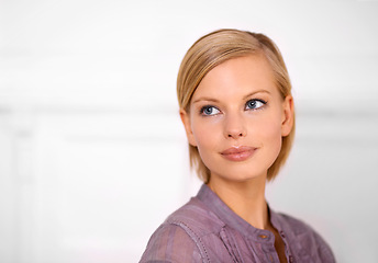 Image showing Beauty model, woman and makeup on face for skincare, confidence and elegant in white background. Female, thinking and idea in backdrop with smile, cosmetics and mockup space in isolated studio