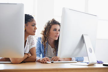 Image showing Happy business women, working or computer at desk in office or teamwork diversity for writing ebook. Journalist, review or collaboration by desktop on project or online research for magazine editing