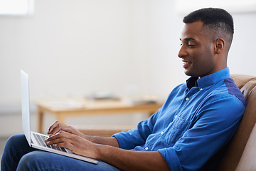 Image showing Man, laptop and online for remote work at home, freelancer and copywriting in living room. Black male person, happy and plan on tech or connection for website, journalist and research for article