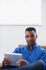 Image showing Man, tablet and portrait for social media at home, online and internet for website or blog. Black male person, movies and streaming entertainment on couch, ecommerce and app for shopping on weekend