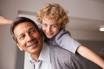 Image showing Portrait, man and child with piggyback for multiracial family, bonding and together at home. Happy, retired male person and boy with embrace, care and love for fun, cheerful and play in retirement