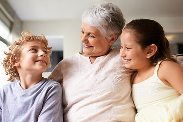 Image showing Happiness, hug and home with granny, grandchildren and bonding together with weekend break and discussion. Love, family and elderly woman with kids and embrace with holiday and playful with vacation