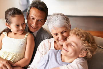 Image showing Hug, grandparents and grandchildren with smile for family, photo and multi generation bonding. Senior couple, boy and girl with laugh, love and happiness for playful relationship together at home