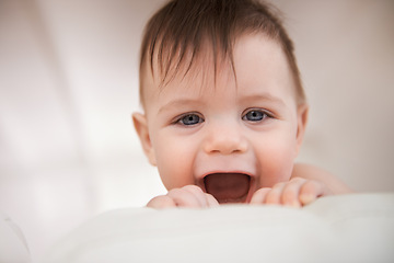 Image showing Baby boy, excited smile and happy for play, growth and development for childhood. Adorable infant, young and healthy kid at home with face expression, learning motor skills and comfortable in house