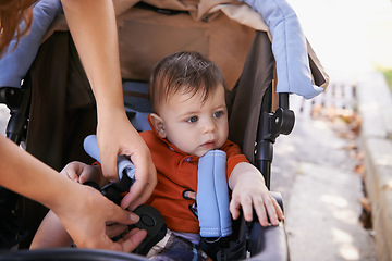 Image showing Baby, pram and outdoor for park, hands and mother for walk and family time with child. Kid, stroller and mom in backyard, nature and toddler for development and safety for stroll after day care