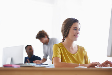 Image showing Woman, computer and desk in office for professional work, creative research or planning. Copywriter, editor or designer with technology and web at workstation for online at company or corporation