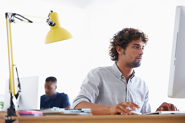 Image showing Computer, serious and business man programming, working or planning project in creative startup office. Desktop, professional and developer at table for information technology, software and coding