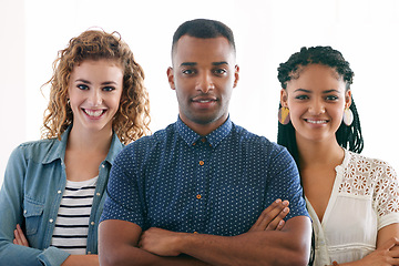 Image showing Business colleagues, smiling and portrait in studio for creative planning or collaboration on white backdrop. Diverse people and interns for teamwork, confidence and pride in career or job