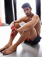 Image showing Man, portrait and boxer in gym for combat, training and determination with gloves for match. Male athlete, mma and fighter at fitness studio for practicing for competition, challenge and kickboxing