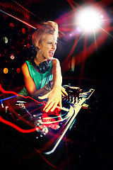 Image showing Woman, turntable and music performance in nightclub as dj for dance floor party event, concert or neon lights. Female person, headphones and record scratch or playlist for weekend, track or new year