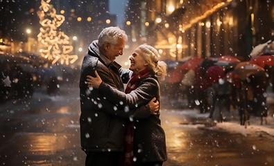 Image showing In the serene snowfall, an elderly couple shares a heartfelt embrace, enveloped in the warm glow of love on a wintry night