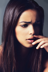 Image showing Woman, hair and confused for beauty, cosmetology and microblading with frown on dark grey background. Closeup, frustrated and worried female person with flawless skin, glossy hairstyle and studio