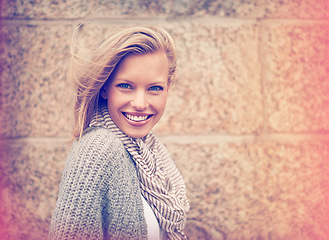 Image showing Autumn, fashion and portrait of happy woman in wall, outdoor and brick background. Casual, style and girl with beauty from makeup, cosmetics or positive attitude in city with cardigan and scarf