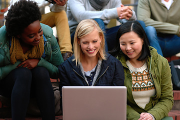 Image showing University, women and laptop on stairs outdoor for research, relax or break on campus with social media. College, students and smile with technology for internet, streaming or learning and diversity